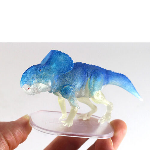 Glow in the dark Protoceratops held in the hand.